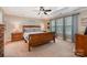 Inviting bedroom with coffered ceiling, and a large window offering plenty of natural light at 7730 Windsor Forest Pl, Harrisburg, NC 28075