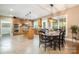 Well-designed kitchen features an island, custom cabinetry, and a dining area perfect for Gathering meals and gatherings at 7730 Windsor Forest Pl, Harrisburg, NC 28075