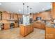 Spacious kitchen featuring custom cabinets, granite countertops, and stainless steel appliances at 7730 Windsor Forest Pl, Harrisburg, NC 28075