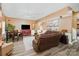 Spacious living room featuring a comfortable sofa, dining area, and stylish decor, ideal for relaxation and entertaining at 7730 Windsor Forest Pl, Harrisburg, NC 28075