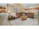 Inviting living room featuring a large sectional sofa, stylish decor, and hardwood floors, perfect for relaxation and socializing at 7730 Windsor Forest Pl, Harrisburg, NC 28075