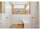 Charming mud room entrance with bench seating and decorative accents at 7730 Windsor Forest Pl, Harrisburg, NC 28075