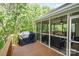 Inviting screened porch with wood flooring and outdoor seating area at 7730 Windsor Forest Pl, Harrisburg, NC 28075