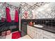 Retro bathroom with striking black and white geometric wallpaper and a step-in shower at 812 Clinton Ave, Lancaster, SC 29720