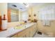 Bright bathroom featuring double sinks, and a vanity with ample storage, blending style and function at 812 Clinton Ave, Lancaster, SC 29720