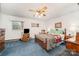 Cozy bedroom featuring traditional decor, carpeted floors and a ceiling fan with lighting at 812 Clinton Ave, Lancaster, SC 29720