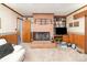 Cozy living room featuring a brick fireplace and built-in shelving at 812 Clinton Ave, Lancaster, SC 29720