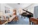 Elegant living room with a grand piano, plush seating, and traditional decor showcasing refined style at 812 Clinton Ave, Lancaster, SC 29720