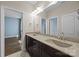Bathroom featuring double sinks and access to a light filled bedroom at 8614 Goodman Park Ct, Charlotte, NC 28277