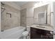 Bathroom with gray tiled walls and granite vanity at 8614 Goodman Park Ct, Charlotte, NC 28277