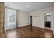 Bedroom with hardwood flooring and large windows for natural light at 8614 Goodman Park Ct, Charlotte, NC 28277