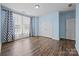 Bedroom with hardwood floors, large windows, and double closets at 8614 Goodman Park Ct, Charlotte, NC 28277