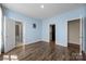 Bedroom with hardwood floors and access to a bathroom and closets at 8614 Goodman Park Ct, Charlotte, NC 28277