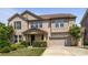 Charming two-story brick home featuring a two-car garage and professionally landscaped front yard at 8614 Goodman Park Ct, Charlotte, NC 28277