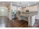 Bright kitchen with stainless steel appliances and granite countertops on the island at 8614 Goodman Park Ct, Charlotte, NC 28277