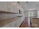 Modern kitchen with granite countertops, tile backsplash, and stainless steel appliances at 8614 Goodman Park Ct, Charlotte, NC 28277