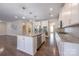 Gourmet kitchen featuring a large island, stainless steel appliances, and white cabinetry at 8614 Goodman Park Ct, Charlotte, NC 28277