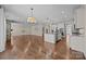 Open floor plan featuring hardwood floors and a kitchen with granite countertops at 8614 Goodman Park Ct, Charlotte, NC 28277