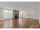 Spacious living room features hardwood floors and a stone fireplace at 8614 Goodman Park Ct, Charlotte, NC 28277