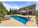 Backyard oasis featuring a gunite pool, patio area, mature landscaping, and gazebo with table and chairs at 8614 Goodman Park Ct, Charlotte, NC 28277