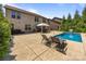 Exterior view of the in-ground pool and backyard featuring ample patio space and lush landscaping at 8614 Goodman Park Ct, Charlotte, NC 28277