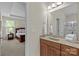 Bathroom with granite countertops, a tiled shower, and convenient access to the Primary bedroom at 907 Lingfield Ln, Waxhaw, NC 28173