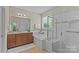 Well-lit bathroom featuring a separate shower, tub, and a spacious vanity at 907 Lingfield Ln, Waxhaw, NC 28173