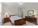 Bedroom with wood furniture, neutral walls, carpet, and entry to the bathroom at 907 Lingfield Ln, Waxhaw, NC 28173