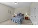 Neutral bedroom with carpet, side tables with lamps, and a queen bed at 907 Lingfield Ln, Waxhaw, NC 28173