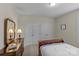 Cozy bedroom with neutral walls, carpet, dresser, and double door closet at 907 Lingfield Ln, Waxhaw, NC 28173