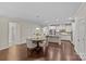 Dining room offers an open design to the kitchen and living spaces with dark wood floors at 907 Lingfield Ln, Waxhaw, NC 28173