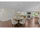 Open concept dining room showcasing a dining table and a view to the cozy living room at 907 Lingfield Ln, Waxhaw, NC 28173