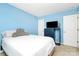 Bright bedroom with blue walls, a comfortable bed, and tasteful furnishings offering a relaxing space at 9212 Scotts Elm Ct, Charlotte, NC 28215