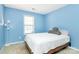 Comfortable bedroom with soft natural light, a cozy bed, and neutral decor creating a peaceful retreat at 9212 Scotts Elm Ct, Charlotte, NC 28215