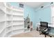 Bright bedroom with a study area featuring built-in bookshelves, perfect for work or study at 9212 Scotts Elm Ct, Charlotte, NC 28215
