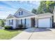 Charming single-story home with a well-manicured lawn and attached one car garage at 9212 Scotts Elm Ct, Charlotte, NC 28215