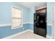 Bright eat in kitchen with black refrigerator and window at 9212 Scotts Elm Ct, Charlotte, NC 28215