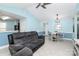 Bright living room with tile floors and light blue walls at 9212 Scotts Elm Ct, Charlotte, NC 28215