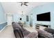 Bright living room with tile floors, light blue walls, and lots of natural light at 9212 Scotts Elm Ct, Charlotte, NC 28215