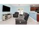 Bright living room with tile floors and a door to the outside at 9212 Scotts Elm Ct, Charlotte, NC 28215