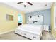 Cozy main bedroom featuring tray ceilings, a ceiling fan, and neutral colors at 9212 Scotts Elm Ct, Charlotte, NC 28215