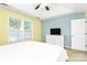 Bright main bedroom with a white dresser, large window, and neutral colors at 9212 Scotts Elm Ct, Charlotte, NC 28215