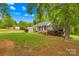 Charming home with a manicured lawn, inviting front porch, and mature landscaping at 1013 E Academy St, Cherryville, NC 28021