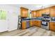 Updated kitchen with wooden cabinets, subway tile backsplash, and stainless steel appliances at 1013 E Academy St, Cherryville, NC 28021