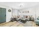 Cozy living room featuring stylish decor, lots of natural light, and wood-look flooring at 1013 E Academy St, Cherryville, NC 28021