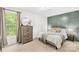Serene bedroom with a panel accent wall, neutral tones, and ample natural light at 1013 E Academy St, Cherryville, NC 28021