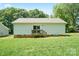 Expansive backyard with lush lawn, ideal for outdoor activities and relaxation at 1013 Old Charlotte Rd, Statesville, NC 28677