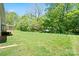 Large backyard with mature trees perfect for outdoor activities, gardening, or relaxation at 1013 Old Charlotte Rd, Statesville, NC 28677