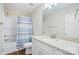 Modern bathroom featuring granite countertops, white cabinetry and tub with shower at 1013 Old Charlotte Rd, Statesville, NC 28677