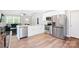 Modern kitchen with stainless appliances, white cabinets, and open layout at 1013 Old Charlotte Rd, Statesville, NC 28677